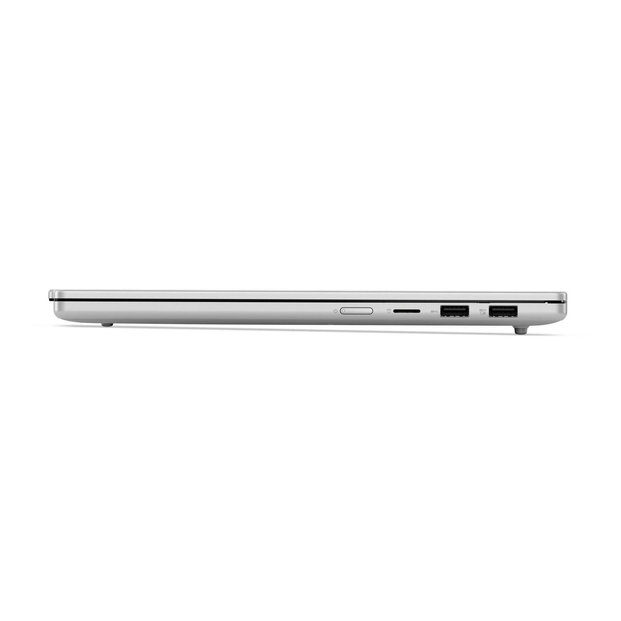 Seitenansicht eines schlanken silbernen Laptops im geschlossenen Zustand, die das Profil mit einigen Anschlüssen und einer Auswurftaste am Rand zeigt.