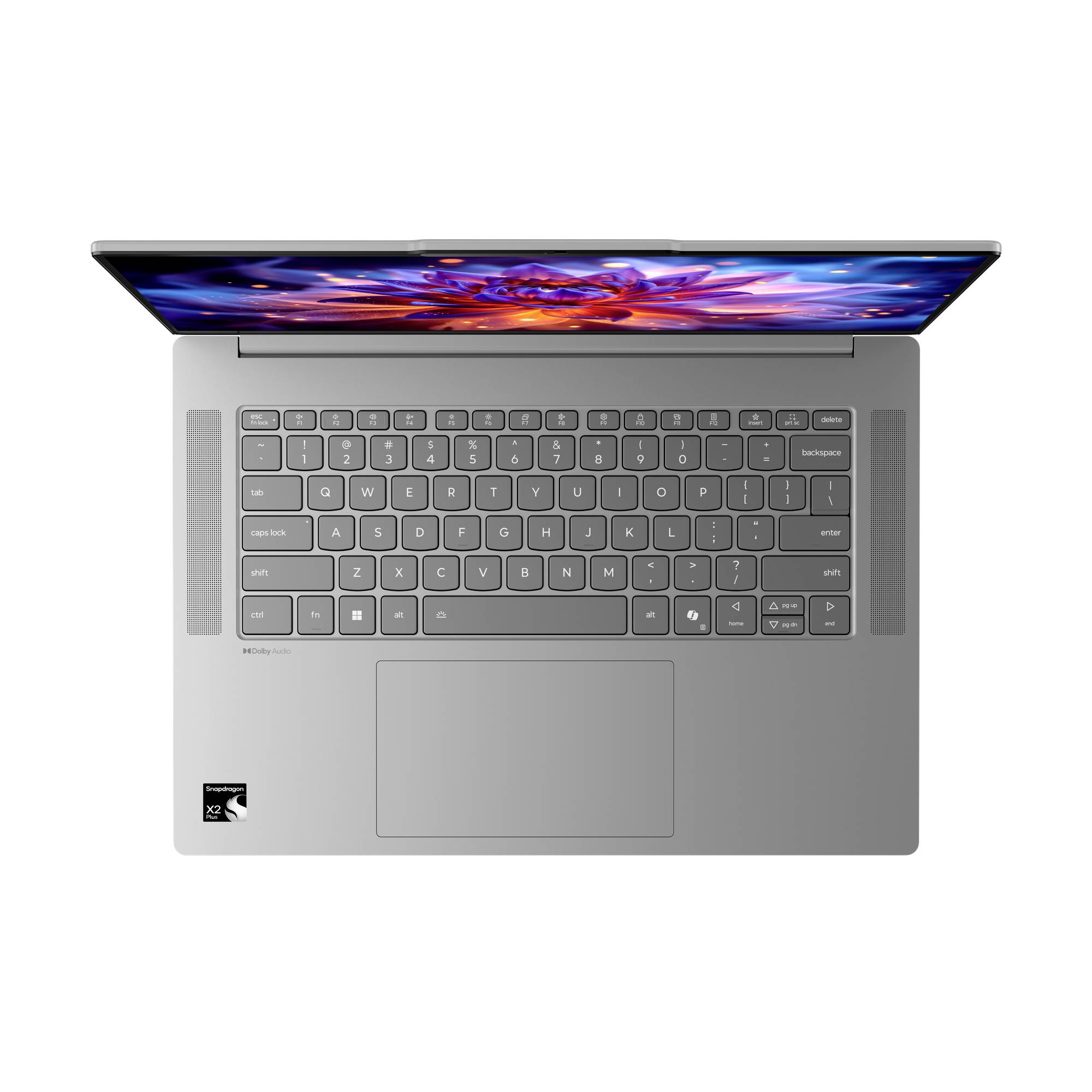 Draufsicht auf einen offenen silbernen Laptop mit Tastatur, großem Trackpad und leuchtender Anzeige mit einem bunten abstrakten Bild.