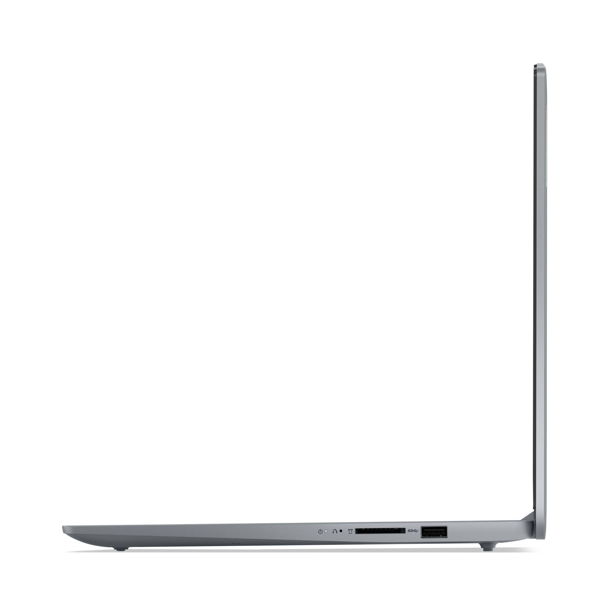 Seitenansicht eines schlanken grauen Laptops geschlossen und aufrecht, das dünne Profil und die Anschlüsse entlang der Basis zeigend.