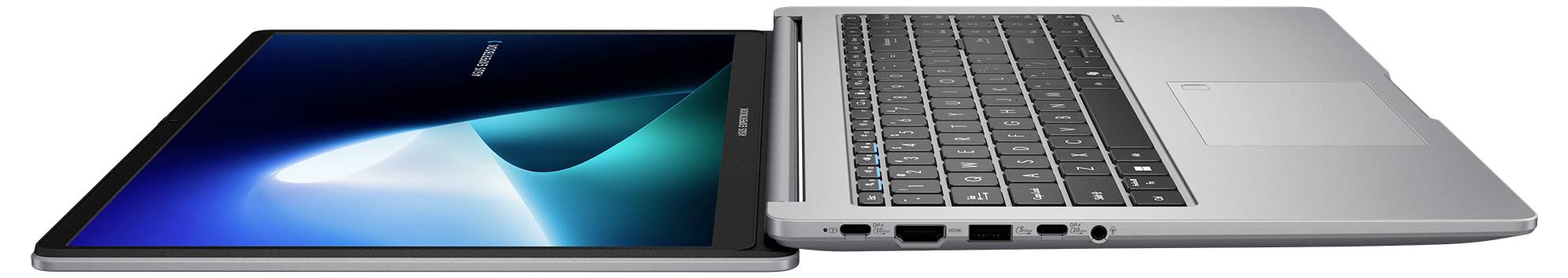 Zwei nebeneinander offene Laptops, einer zeigt einen blauen abstrakten Bildschirm und der andere zeigt eine Tastatur und ein Touchpad.