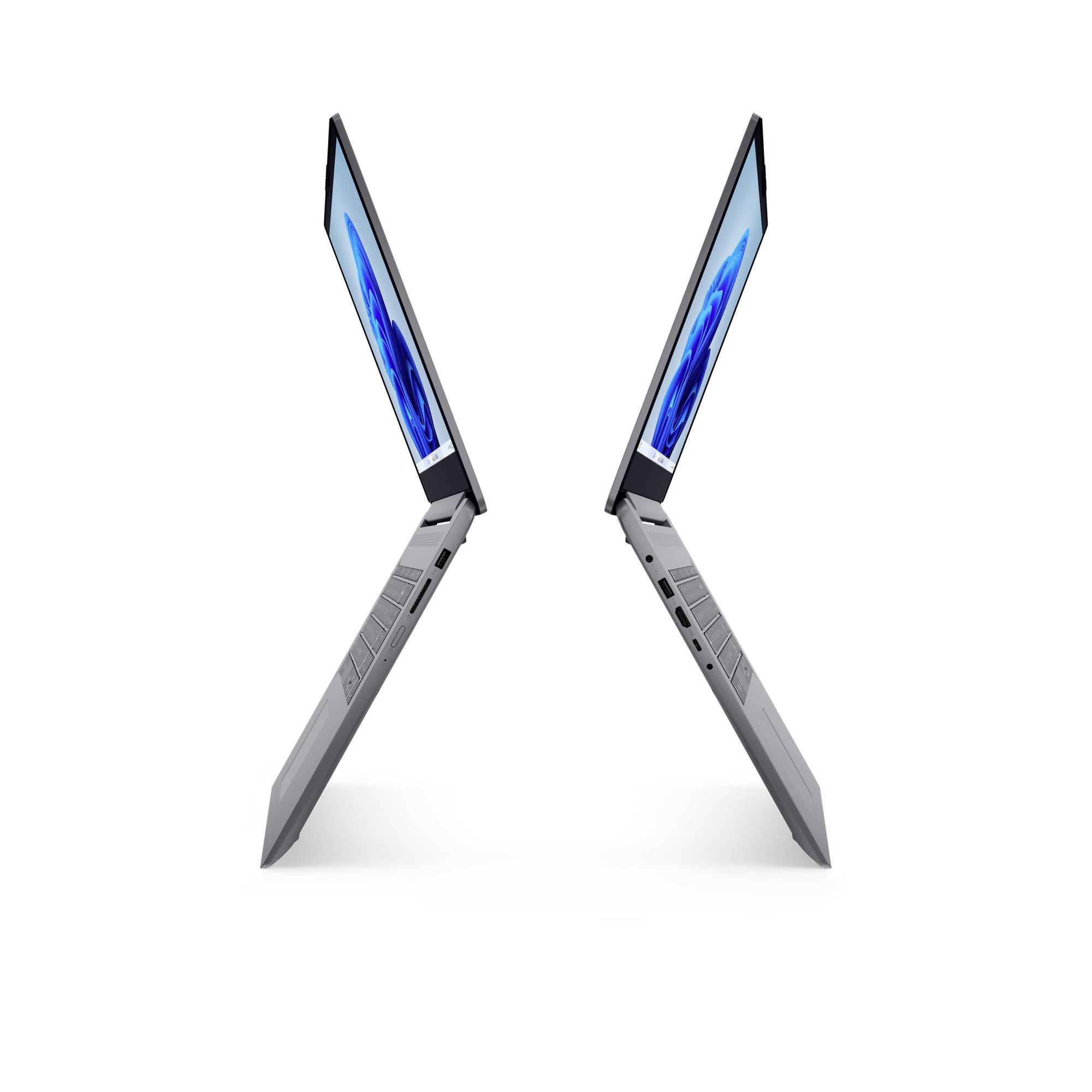 Zwei dünne Laptops, die in einer X-Form geöffnet sind, in Seitenansicht auf weißem Hintergrund.