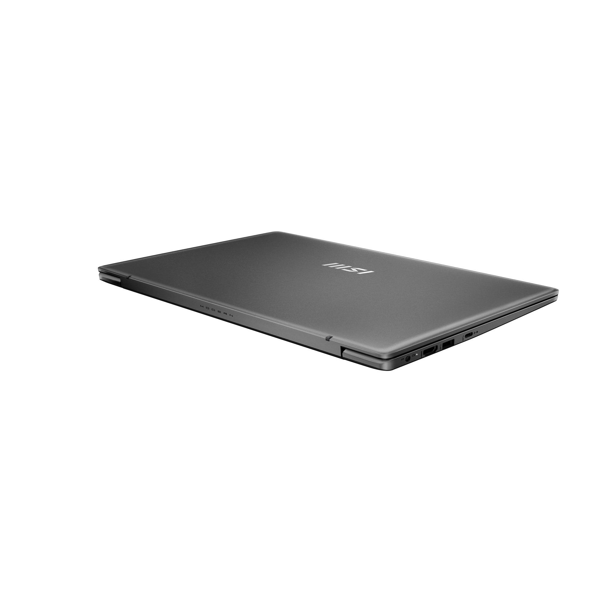 Geschlossener grauer MSI-Laptop in schräger Perspektive auf weißem Hintergrund angezeigt.