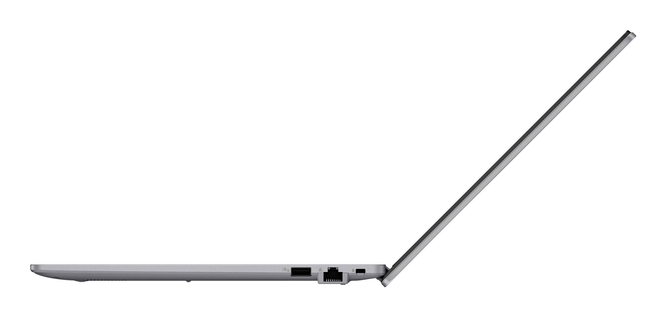 Seitenansicht eines offenen, dünnen silbernen Laptops, der sein schlankes Profil und die Tastaturunterlage zeigt.