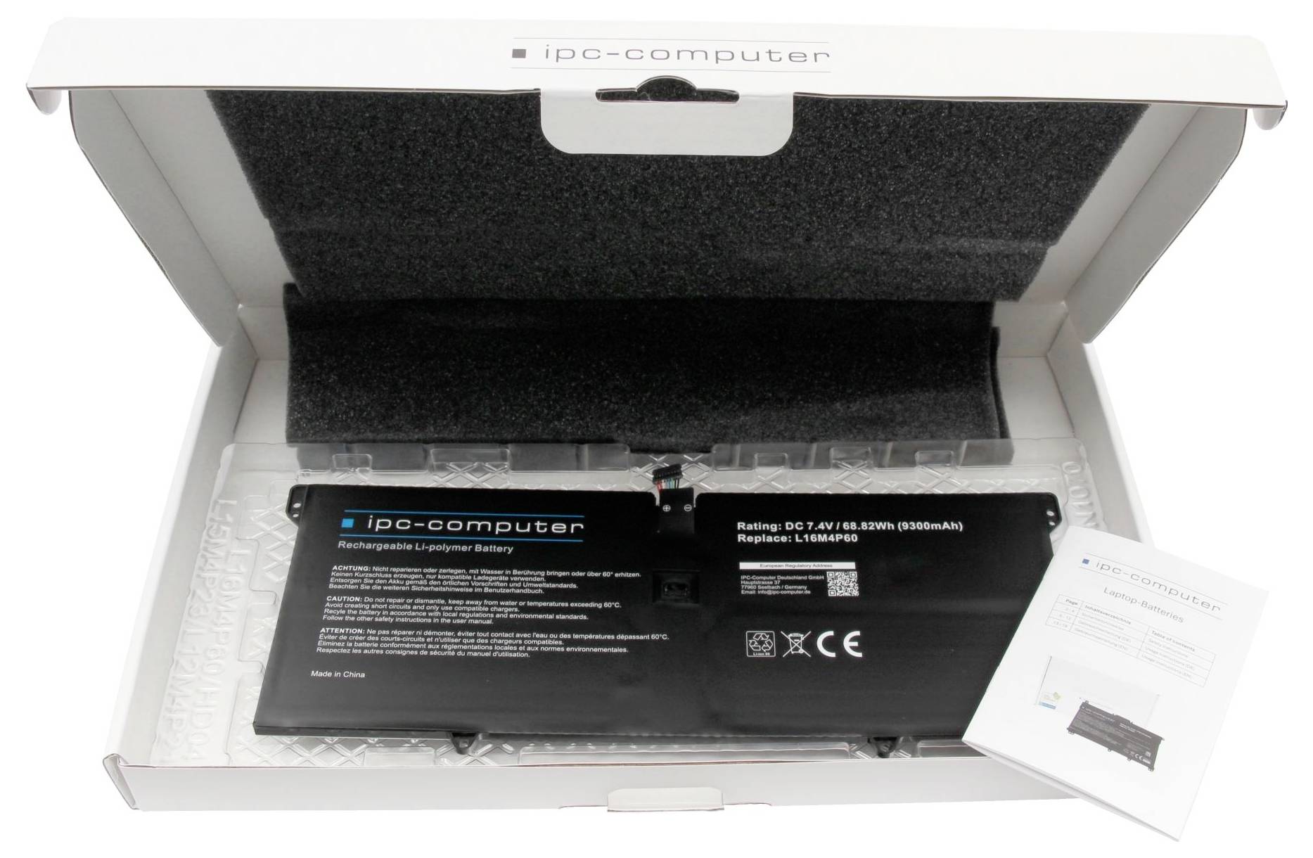 Offene Schachtel mit einem IP-Computer-Laptop-Akku und Bedienungsanleitung, dargestellt in der Verpackung mit Schutzschaum.