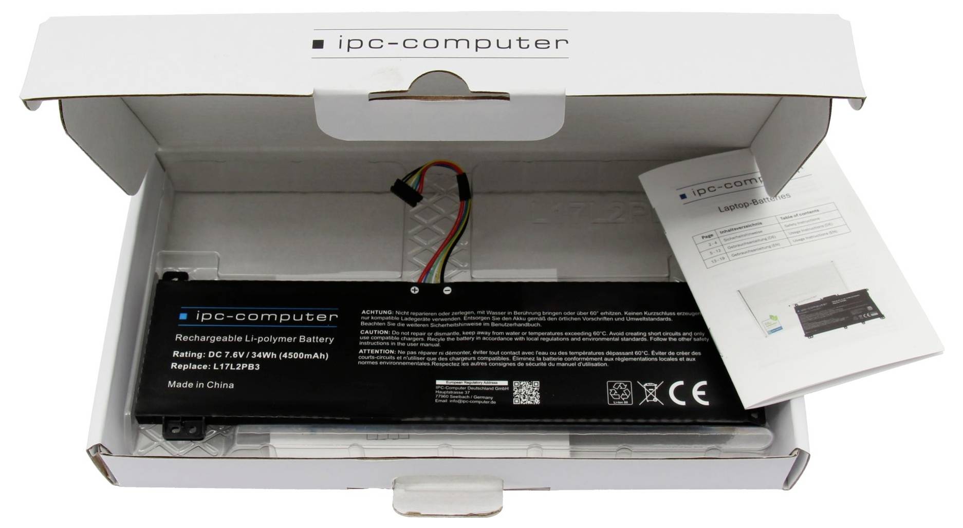 Laptop-Akku in einer offenen IPC-Computerbox mit einem gefalteten Produktblatt