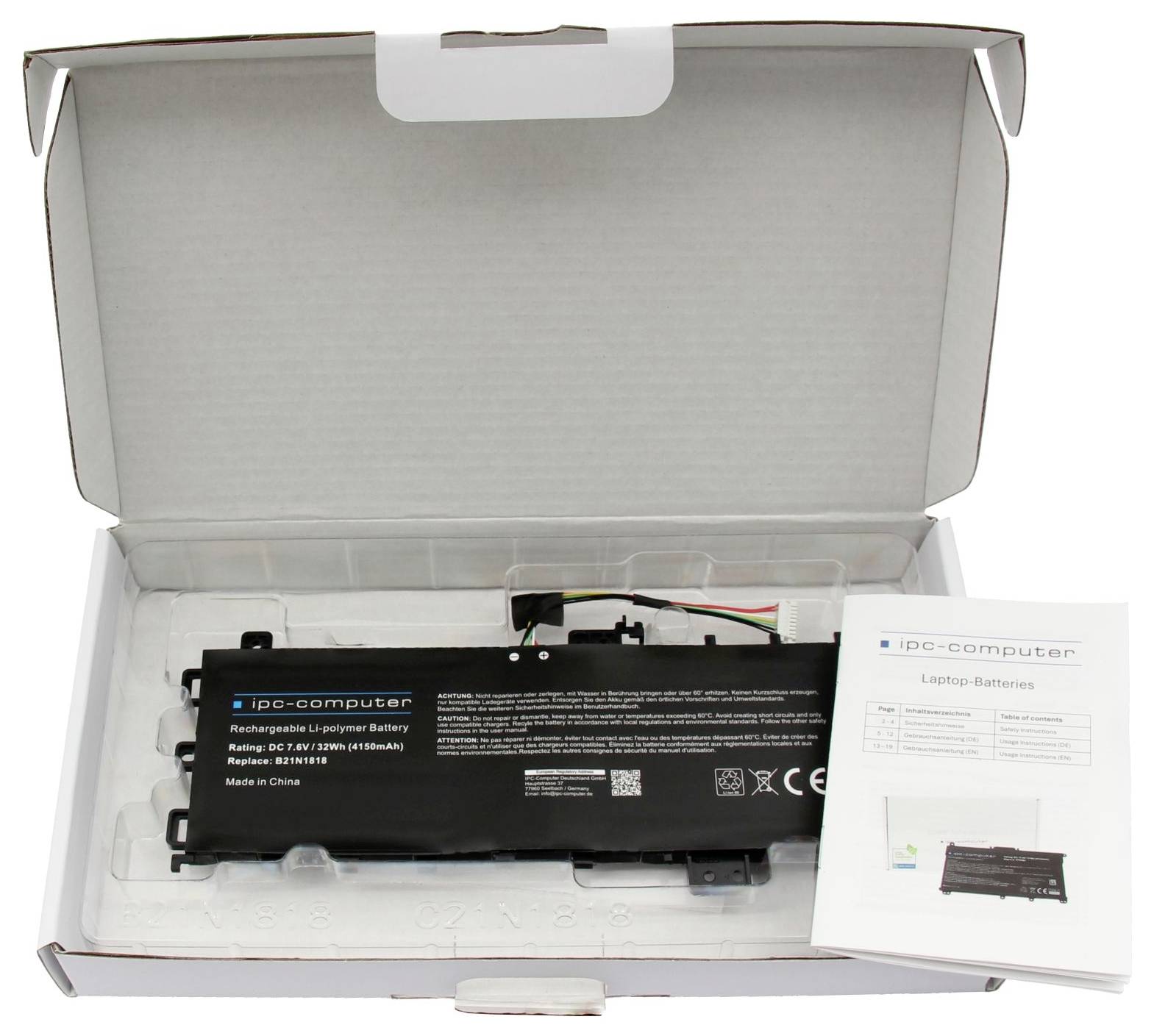 Offene Box mit einem schwarzen IPC-Computer-Akku aus wiederaufladbarem Lithium-Polymer und einer Bedienungsanleitung "Laptop-Batterien".
