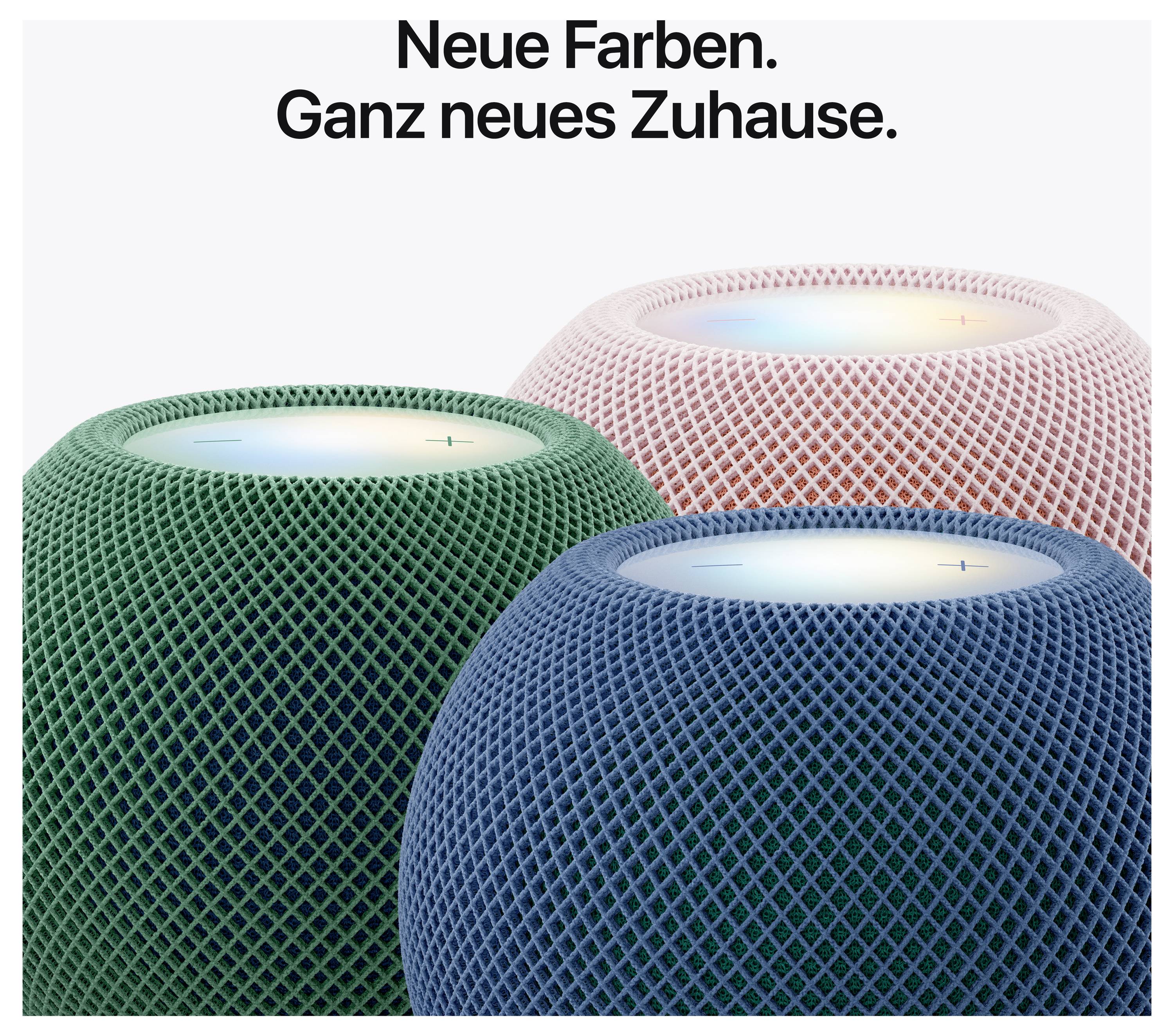 Werbegrafik mit drei farbigen HomePod-Lautsprechern in Grün, Blau und Rosé unter der Überschrift 'Neue Farben. Ganz neues Zuhause.'