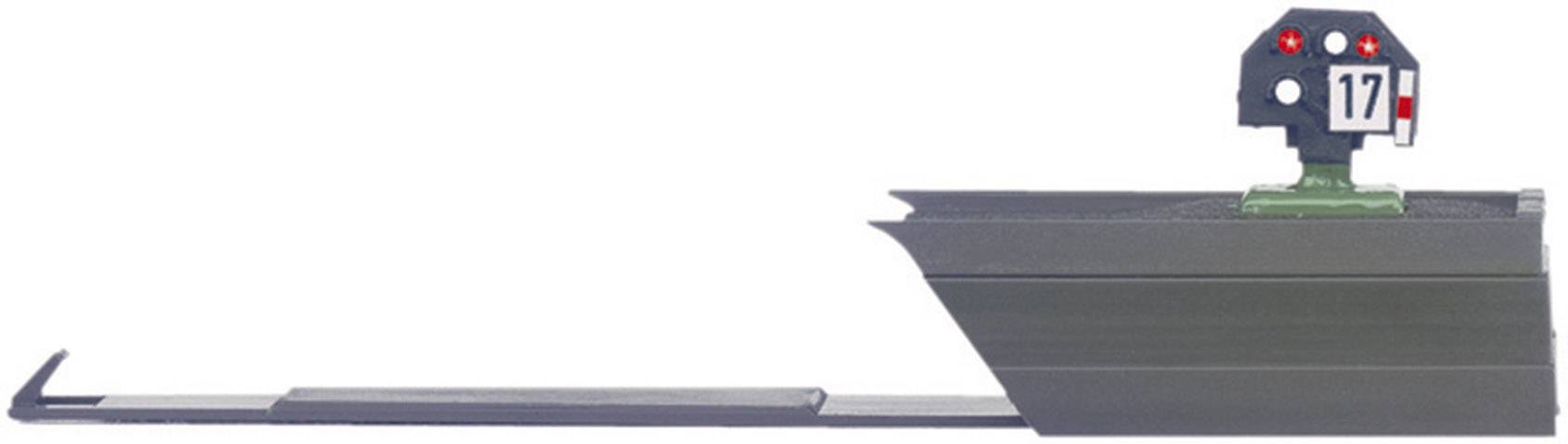 Ein Blocksignal aus der Modelleisenbahnwelt mit einer Anzeige '17' und drei roten Lichtern, montiert auf einem Gleisstück.