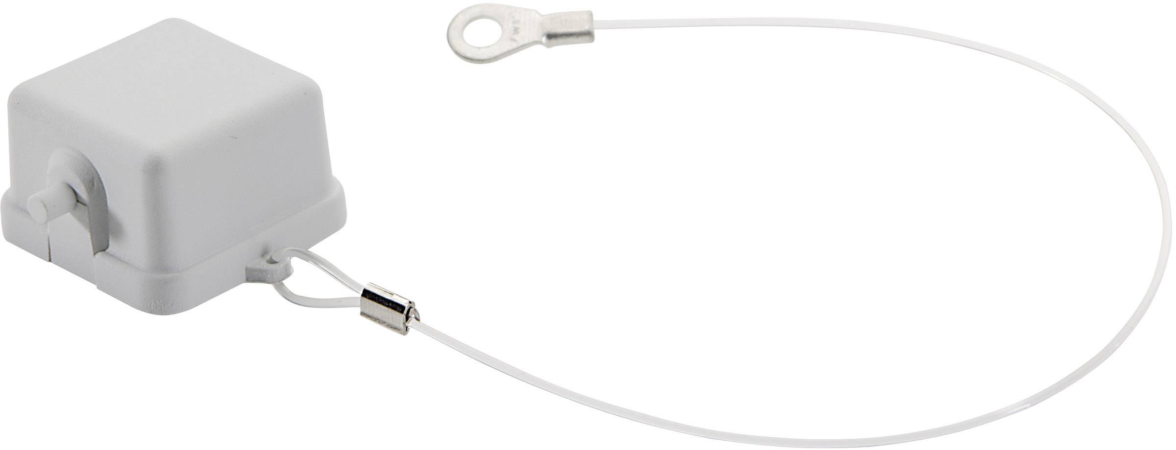 Ein weißer, quadratischer Objekt mit Kabel und Metallring. Es scheint ein elektrischer oder technischer Anschluss zu sein.