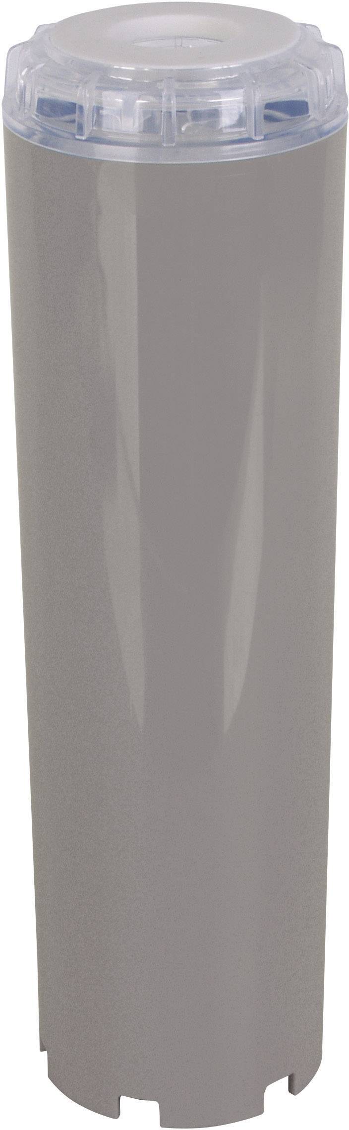 Ein grauer zyklischer Gegenstand mit transparentem Deckel, möglicherweise ein Filter oder eine Patrone, auf weißem Hintergrund.