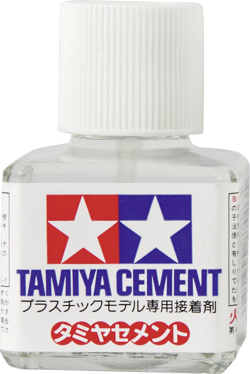 Flasche mit 'Tamiya Cement' Etikett, geeignet zur Verklebung von Plastikmodellen. Enthält Markenzeichen mit Sternen, rot und blau.