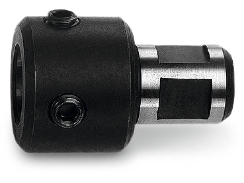 Ein schwarzer Metalladapter mit Zylindergestalt und Schrauben, vermutlich für Maschinen- oder Werkstattanwendungen geeignet.