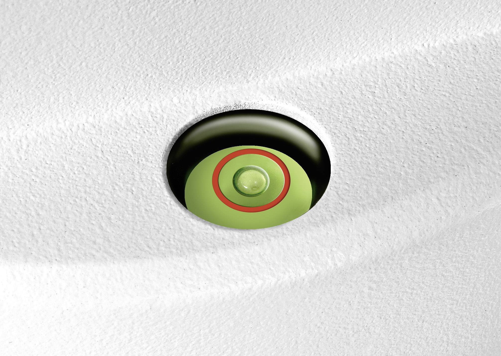 Eine runde grüne Taste in einem tiefen Gehäuse ist von einem roten Kreis umgeben und sitzt in einer strukturierten weißen Oberfläche.