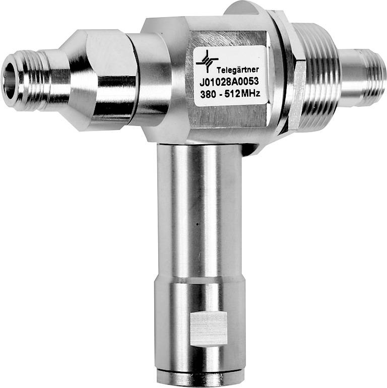 Metallisches Koaxialadapter in T-Form mit Schraubgewinden und Beschriftung 'Telegärtner J01208A0053 380 - 512MHz' auf dem Mittelteilstück.