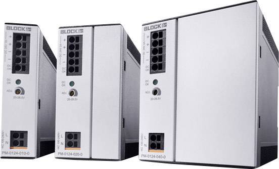 Drei silberne elektronische Geräte nebeneinander, jeweils mit schwarzem Steckfeld und Beschriftung ‘BLOCK’. Die Geräte haben die Modellnummern 'PM-0124-031-0', 'PM-0124-020-0' und 'PM-0124-045-0'.