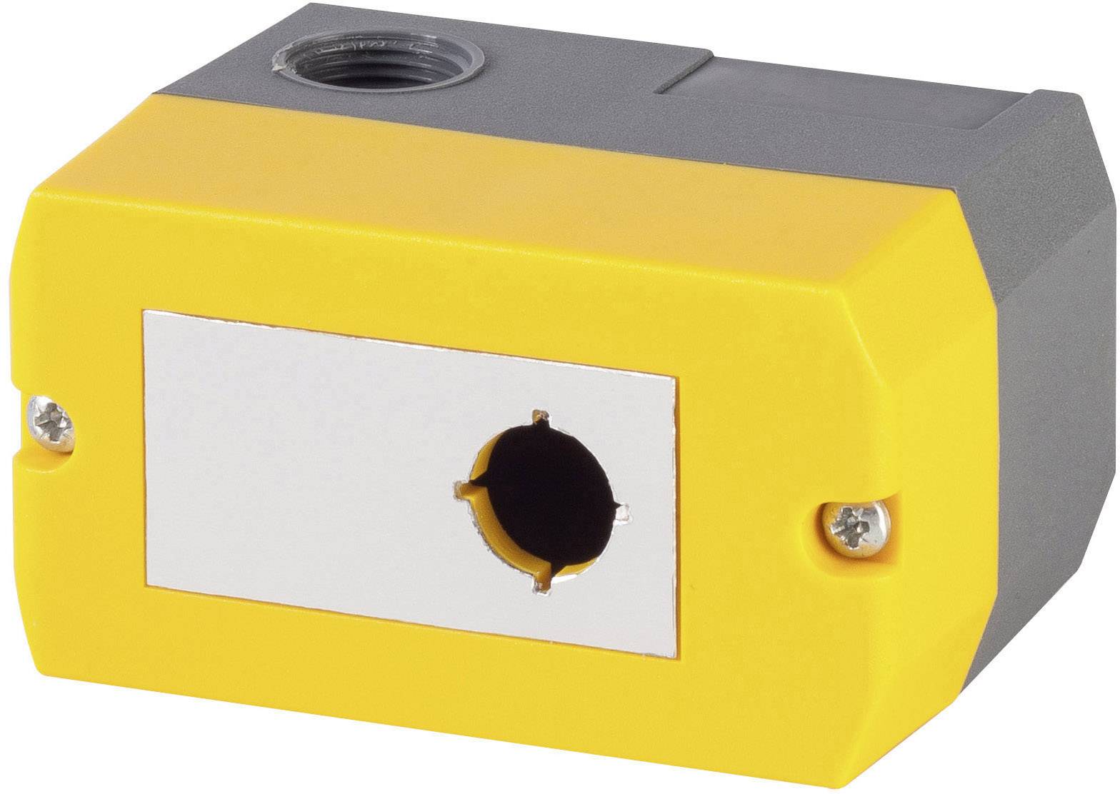 Gelbes und graues rechteckiges Gehäuse mit einer zentralen Öffnung vorne und seitlichen Schrauben, vermutlich für elektronische Komponenten.