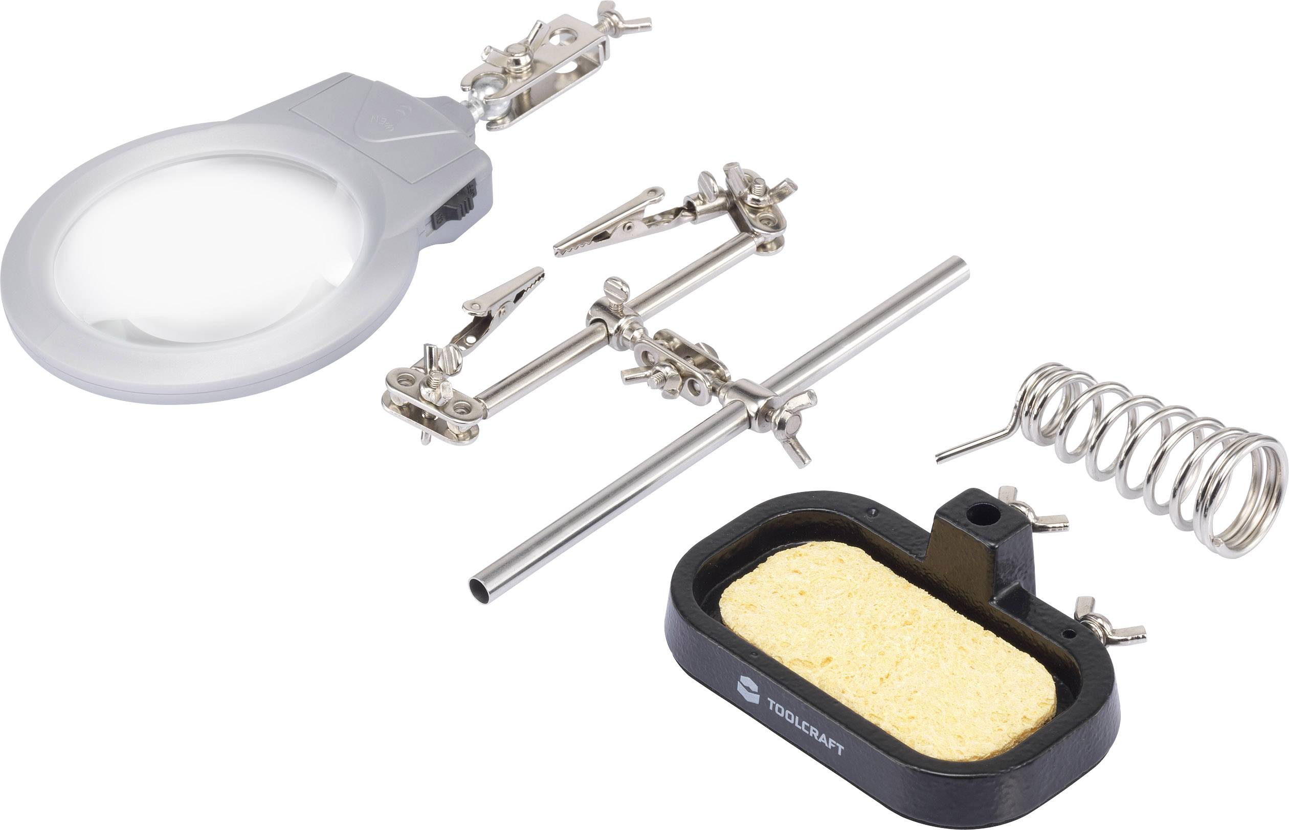 Lupenlampe mit Halterungen und Lötzubehör, einschließlich Schwammhalter und Spiralfeder, zur Unterstützung beim Löten oder Basteln.
