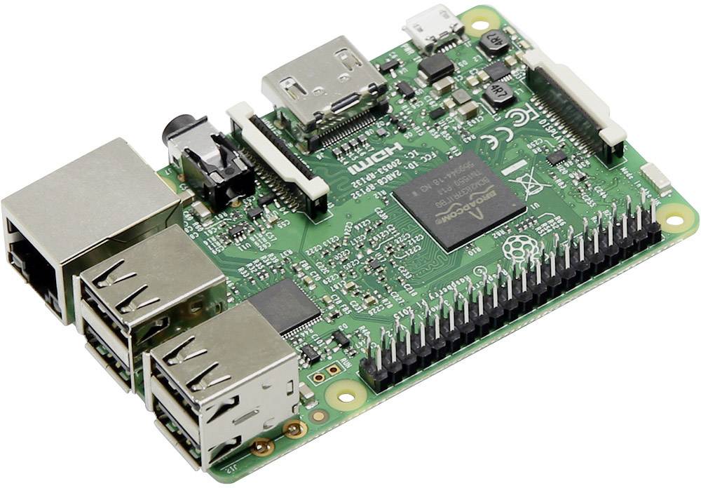 Ein grünes Raspberry Pi-Board mit verschiedenen Anschlüssen und elektronischen Komponenten, darunter USB- und HDMI-Ports.