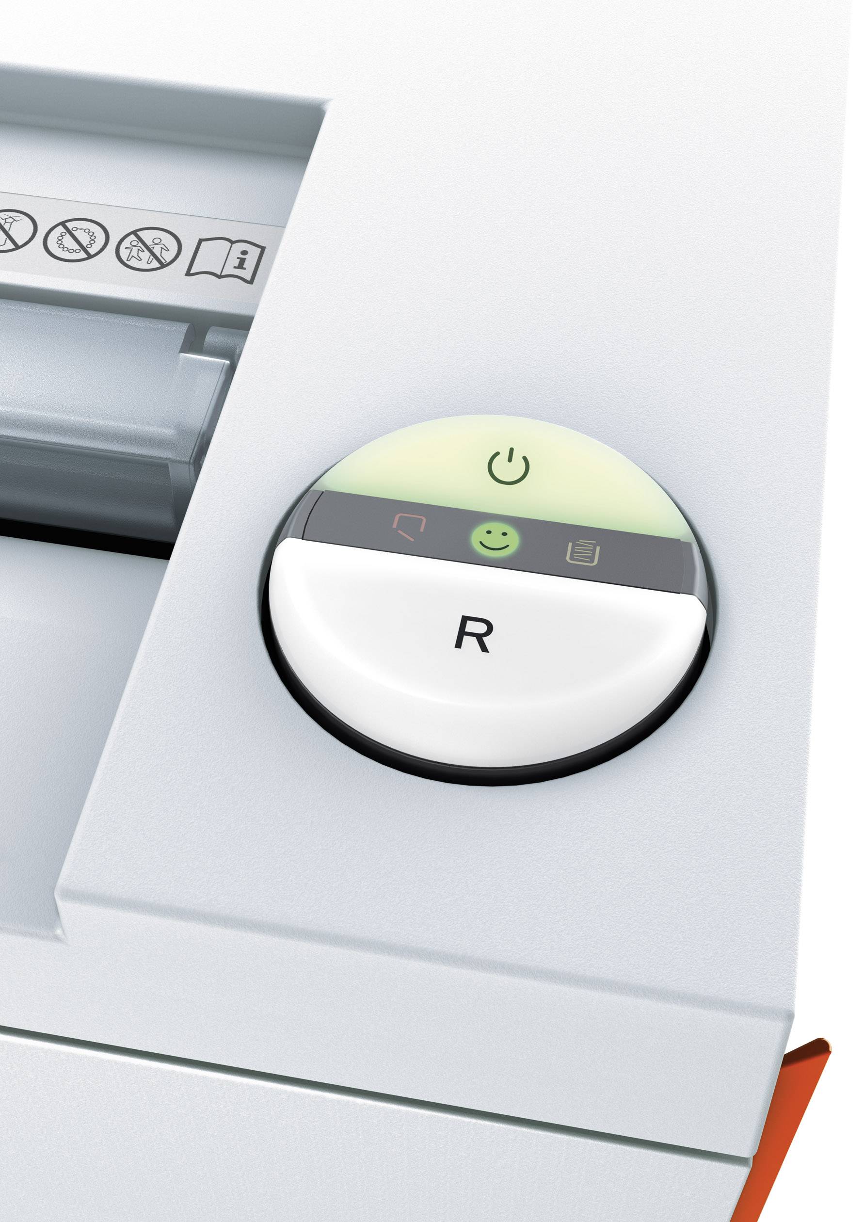 Zum Bild einer Maschine: Ein großer Knopf mit dem Buchstaben 'R', umgeben von Symbolen einer Power-Taste, eines lächelnden Gesichts und einer Papierwarnung.