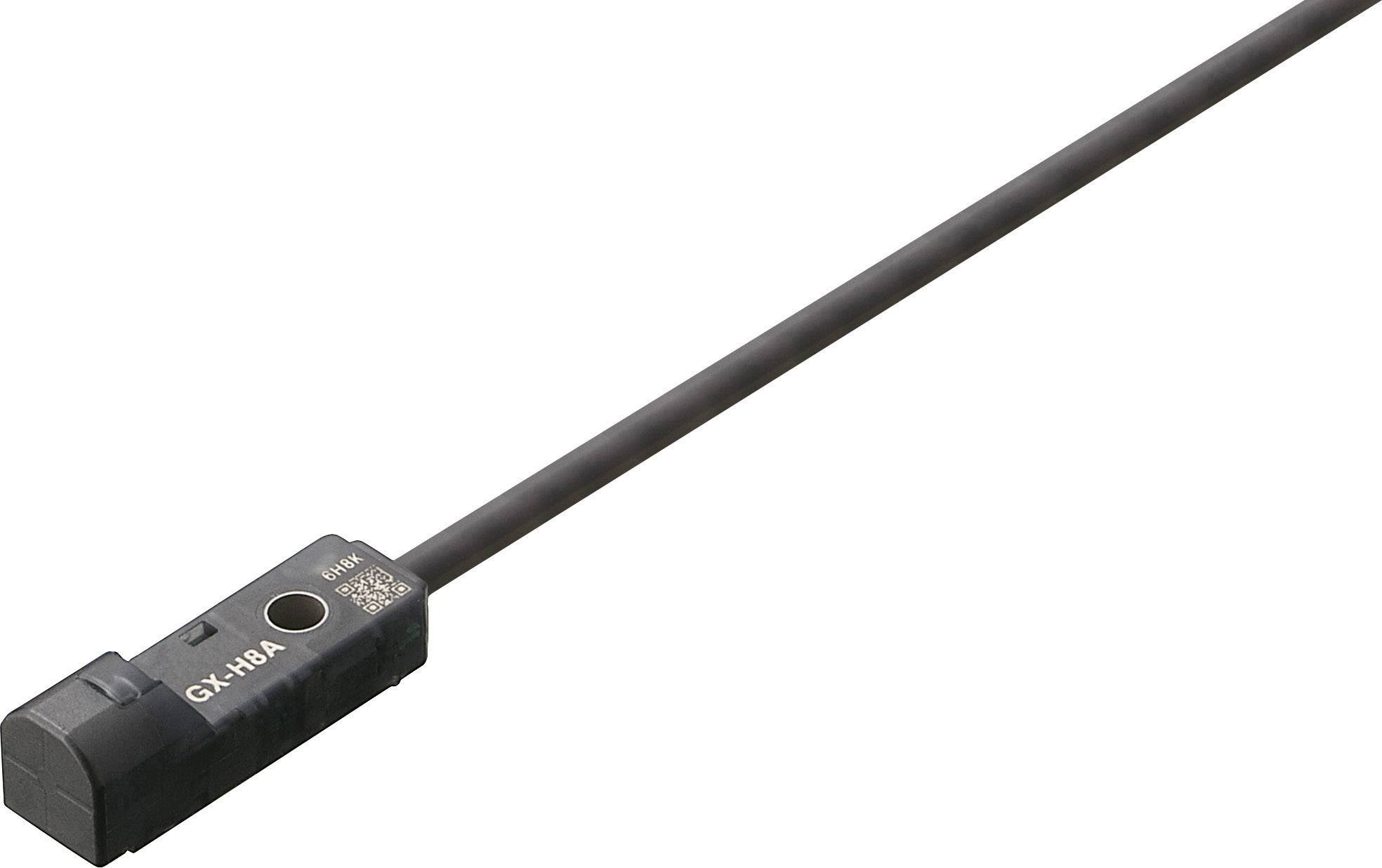 Das Bild zeigt einen elektronischen Sensor mit einem langen Kabel, das aus dem Gerät herausführt. Der Sensor ist schwarz und rechteckig.