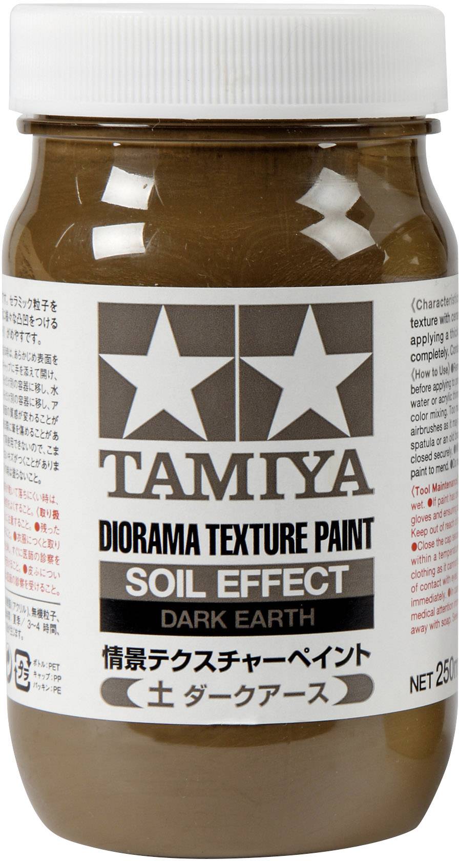 Ein braun-beiges Glasgefäß mit einem Aufkleber, das 'Tamiya Diorama Texture Paint Soil Effect Dark Earth' mit japanischen Schriftzeichen zeigt.