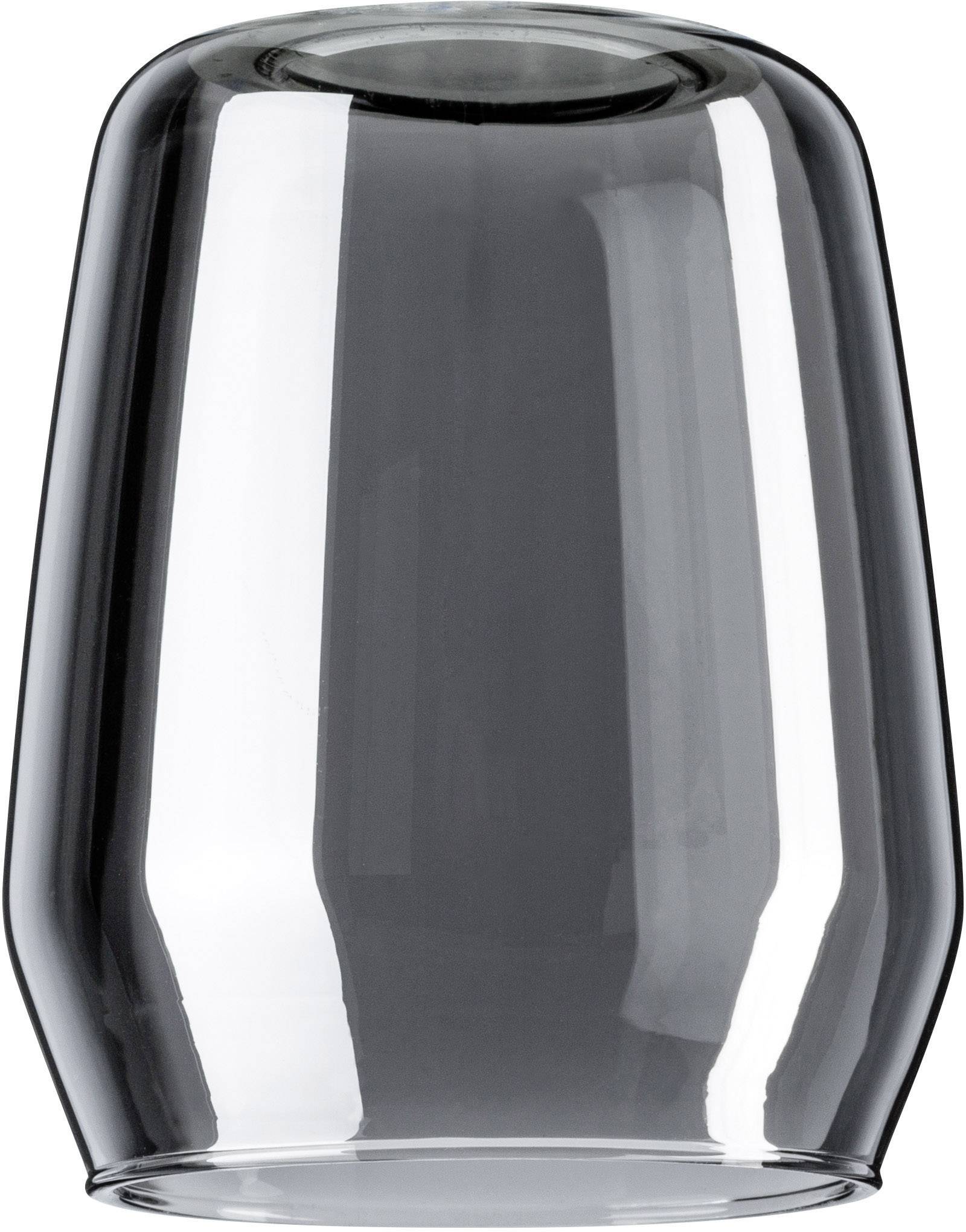 Ein transparenter, umgedrehter Glasbecher mit spiegelnder Oberfläche.