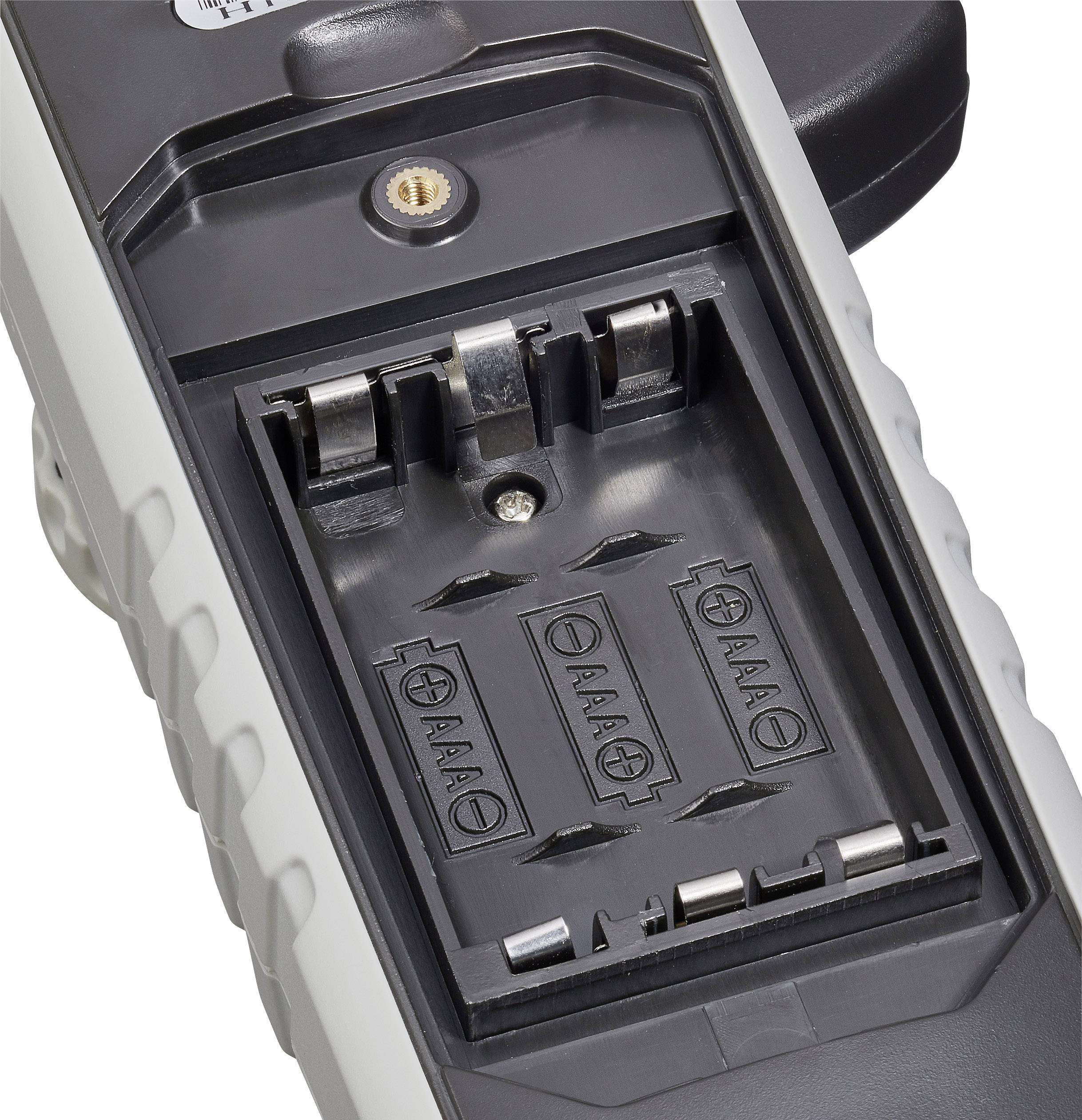 Ein Batteriefach für vier AAA-Batterien, ohne eingesetzte Batterien. Das Fach ist offen und zeigt die Anschlussklemmen.