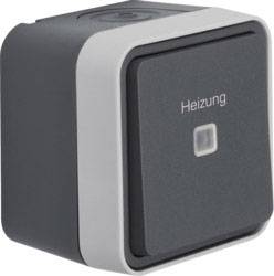 Ein quadratischer, grauer Schalter mit der Aufschrift 'Heizung' in der Mitte. Geeignet zur Steuerung oder Aktivierung der Heizung.