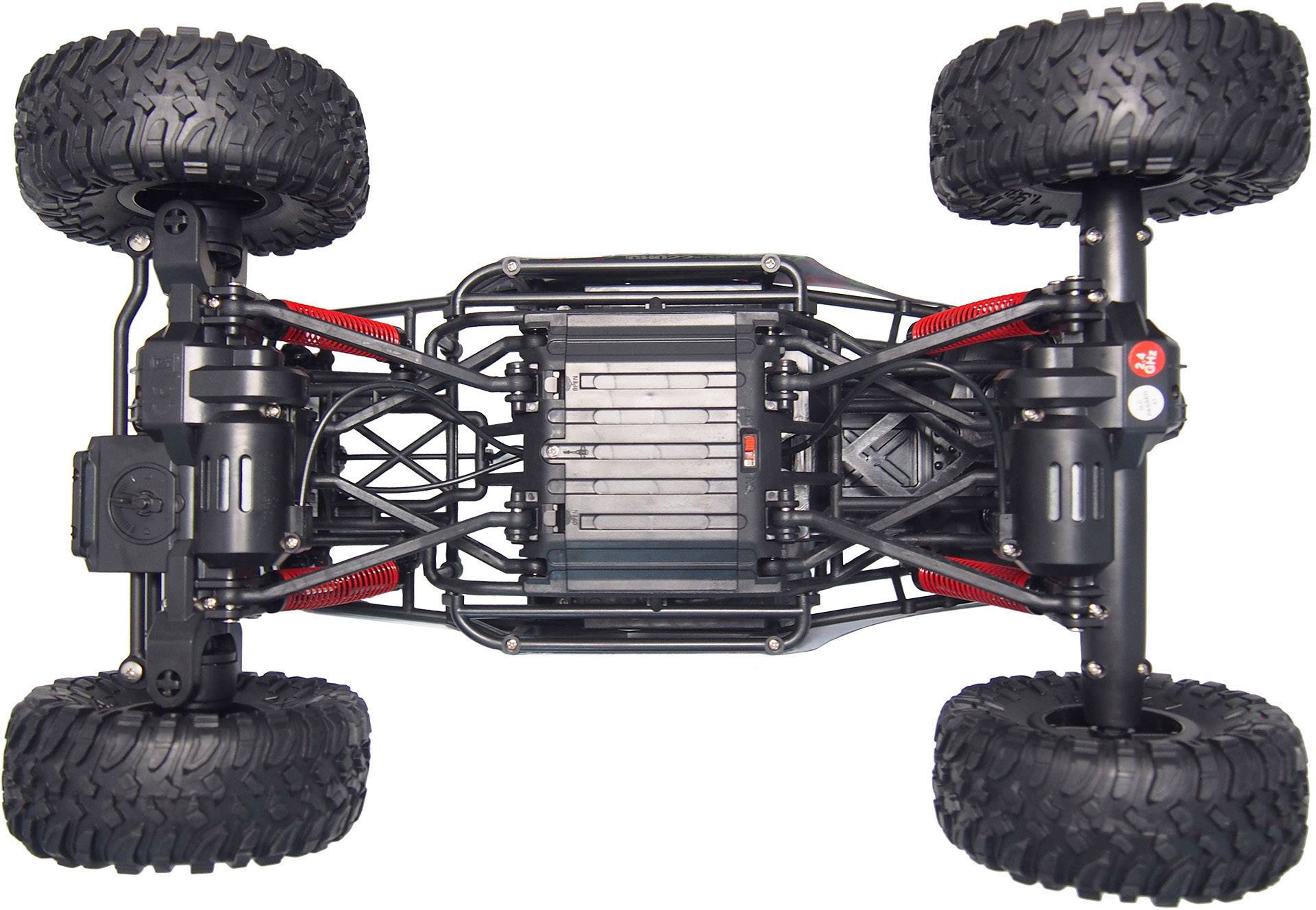 Ferngesteuertes Auto von unten, zeigt Achsen, Federn und Chassis.