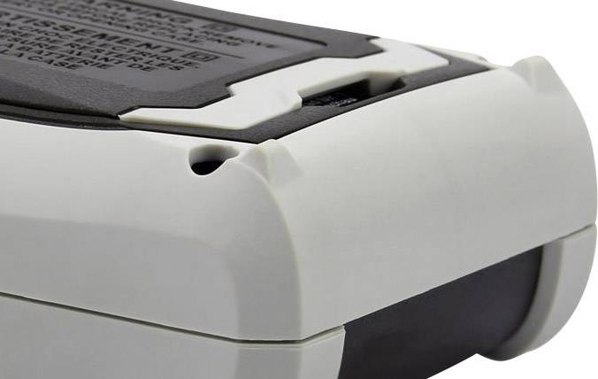 Ein grauer und schwarzer Akkupack mit schimmernder Oberfläche und informativem Etikett auf der Oberseite.