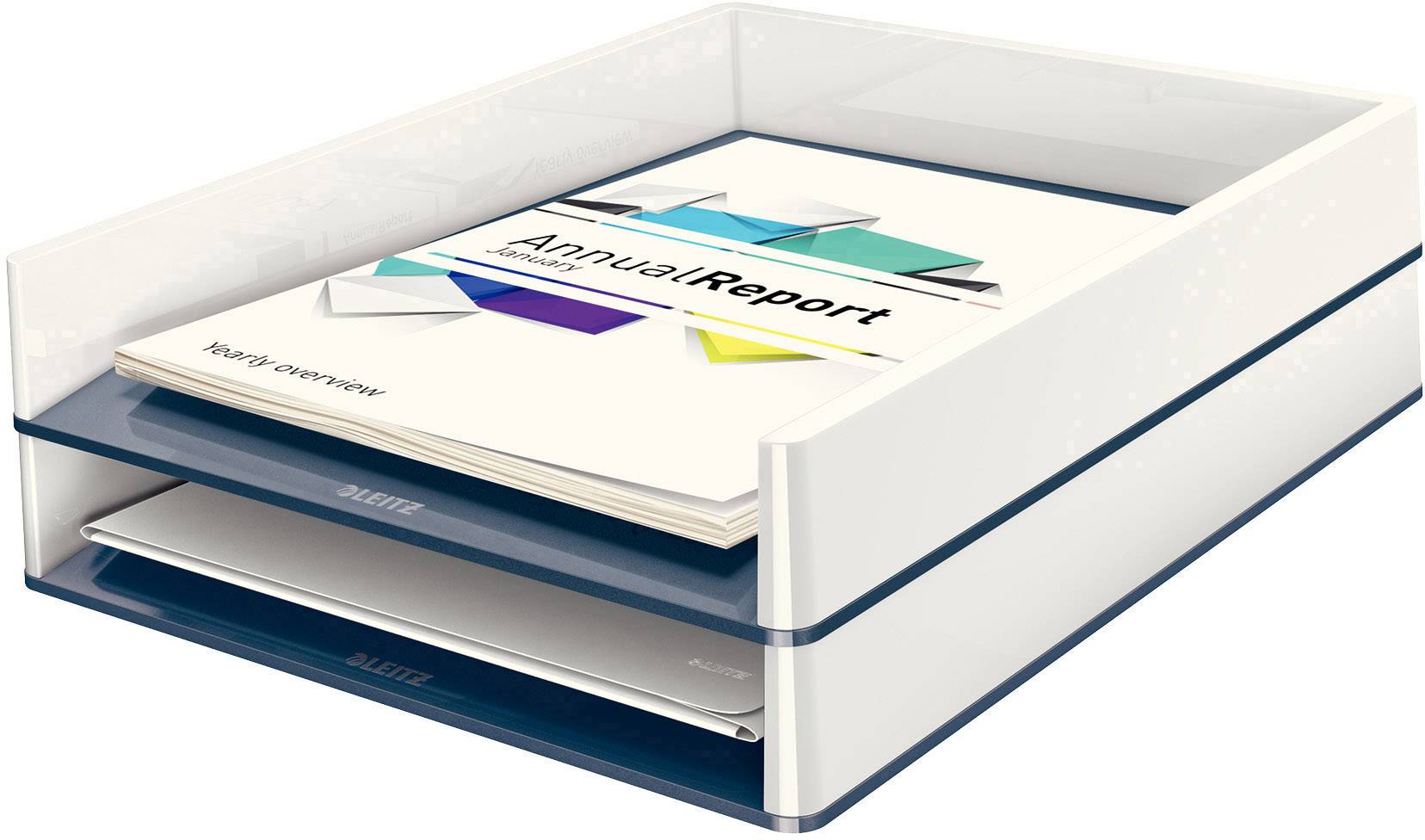 Ein Papierstapel mit dem Titel 'Annual Report', auf einem transparenten Ablagefach liegend.