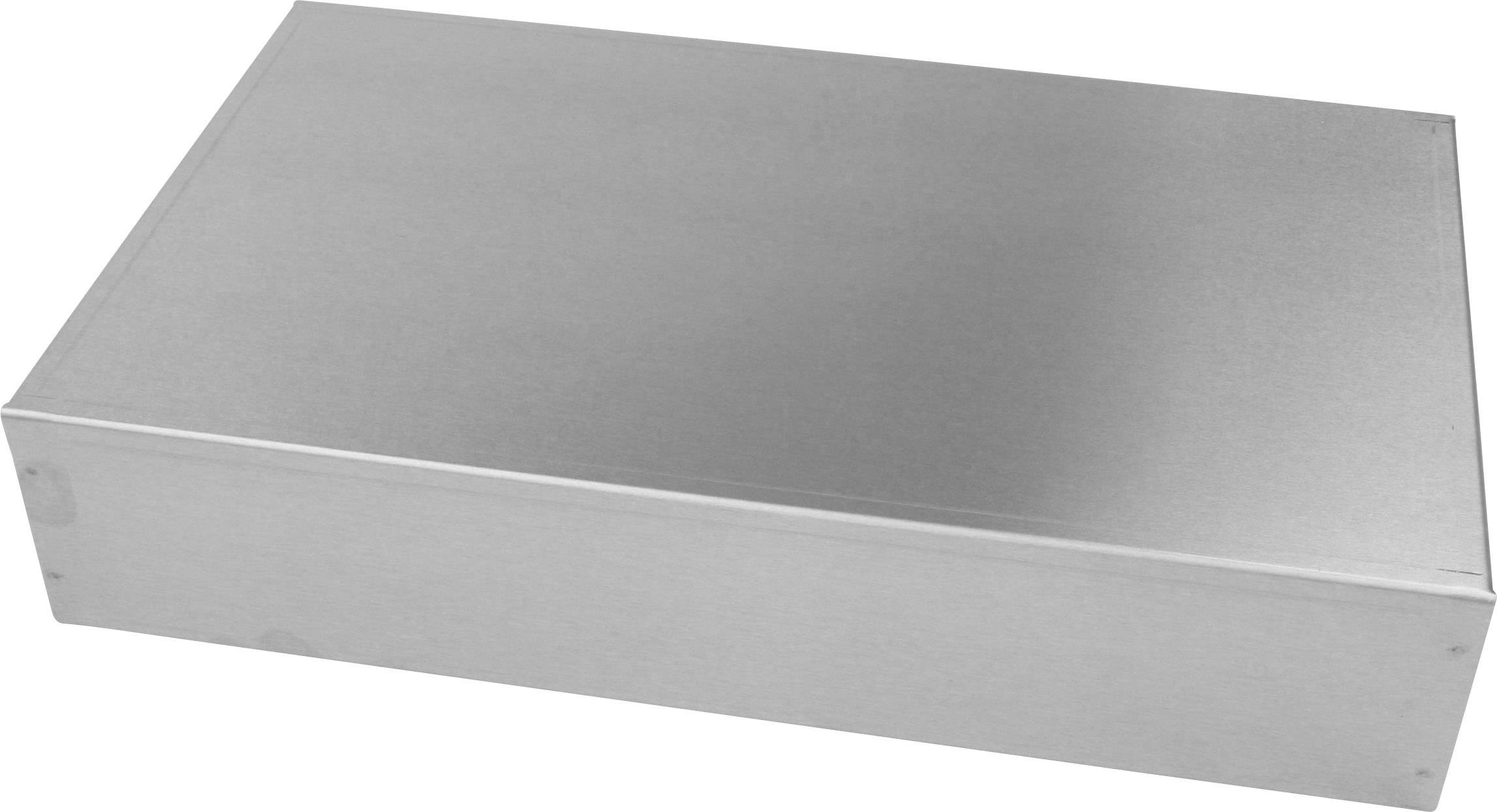 Ein rechteckiger, metallischer Kasten auf einer hellen Fläche.