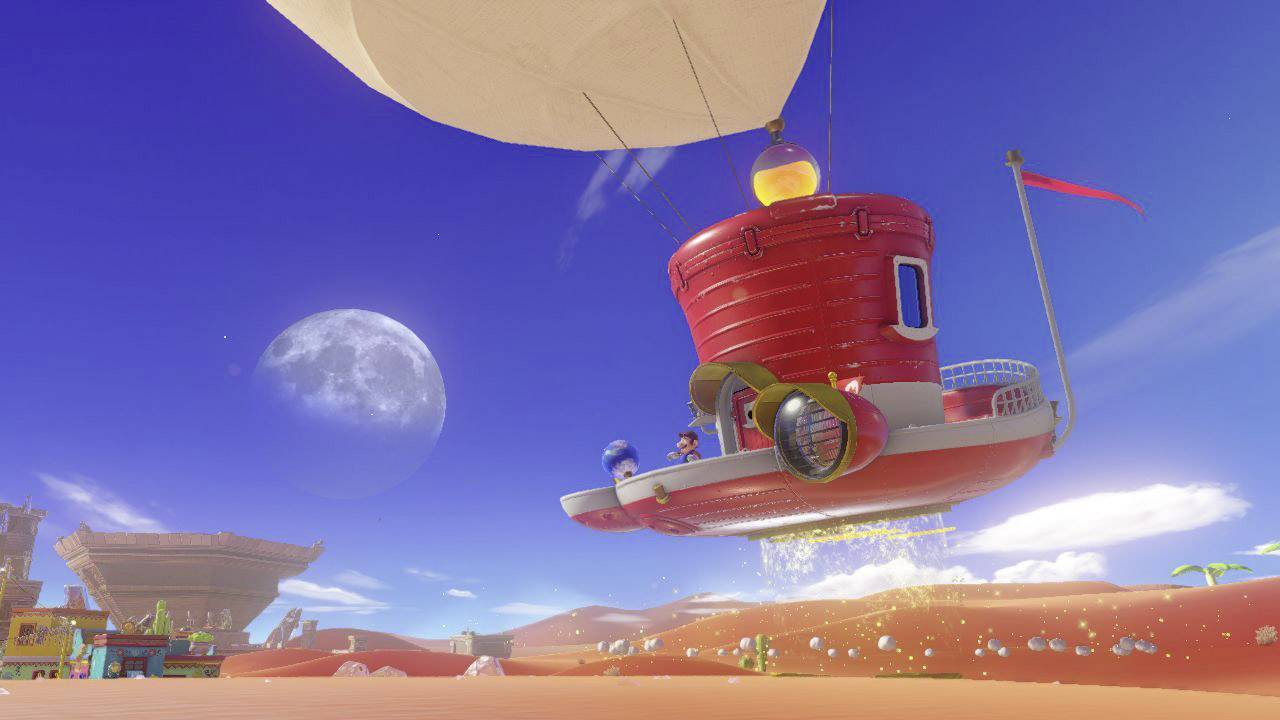 Ein Luftschiff in Form eines Hutes fliegt über eine Wüstenlandschaft mit roten Sanddünen, unter einem klaren, mondbeschienenen Himmel.