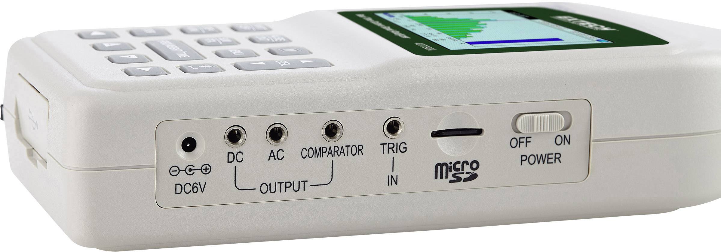 Ein tragbares elektronisches Gerät mit einem Schalter, mehreren Anschlüssen und einem Display, das eine graphische Ausgabe zeigt.
