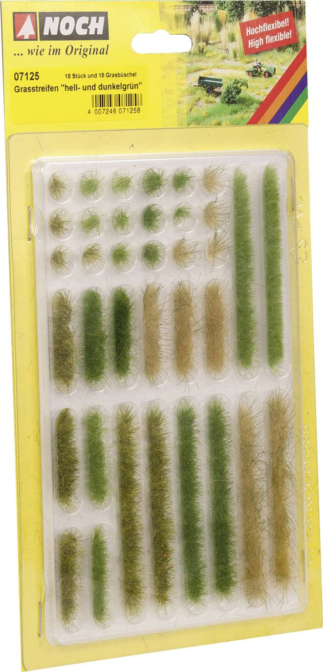 Kunststoffverpackung mit verschiedenen Grasstreifen in hell- und dunkelgrün auf gelbem Hintergrund, geeignet für Modellbau.