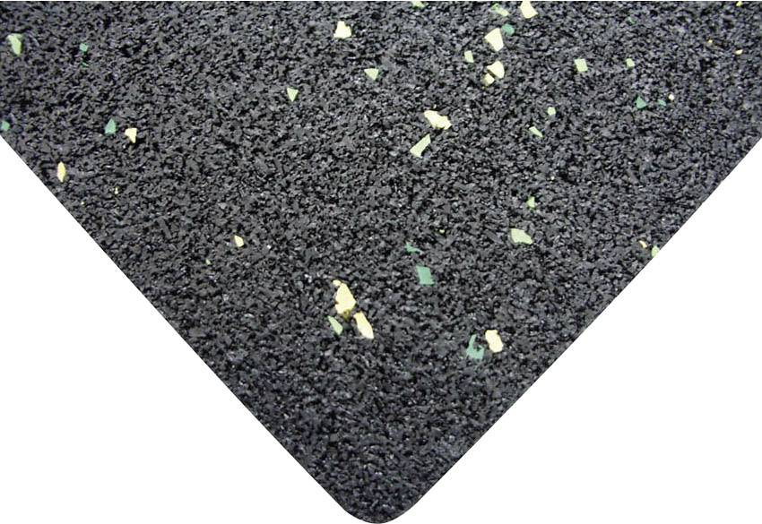 Nahaufnahme eines schwarzen Schaumstoffmaterials mit eingestreuten gelben und grünen Partikeln.