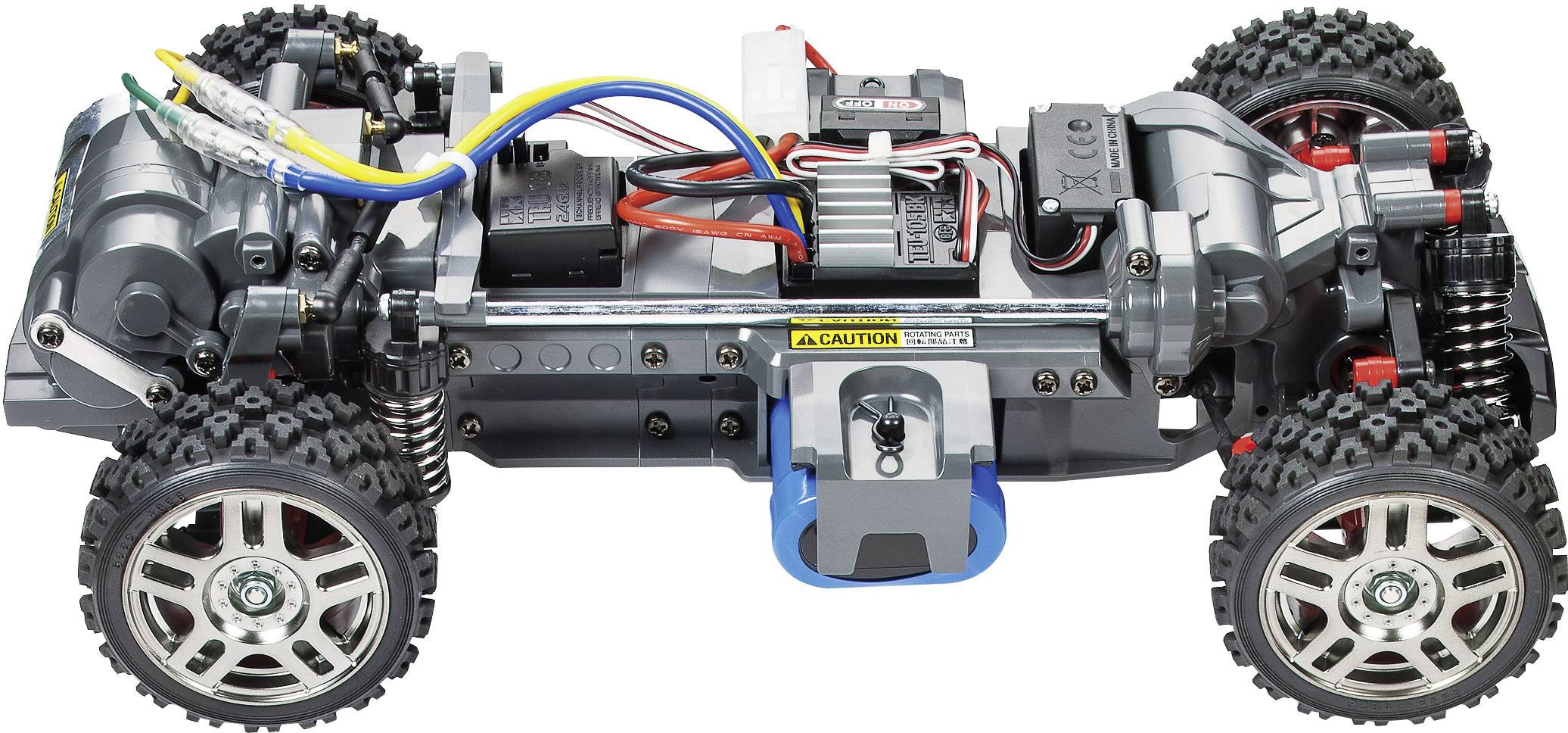 Ferngesteuertes Auto-Chassis mit sichtbarer Elektronik und Verkabelung, offenes Design, grobstollige Reifen und Metallrahmen.
