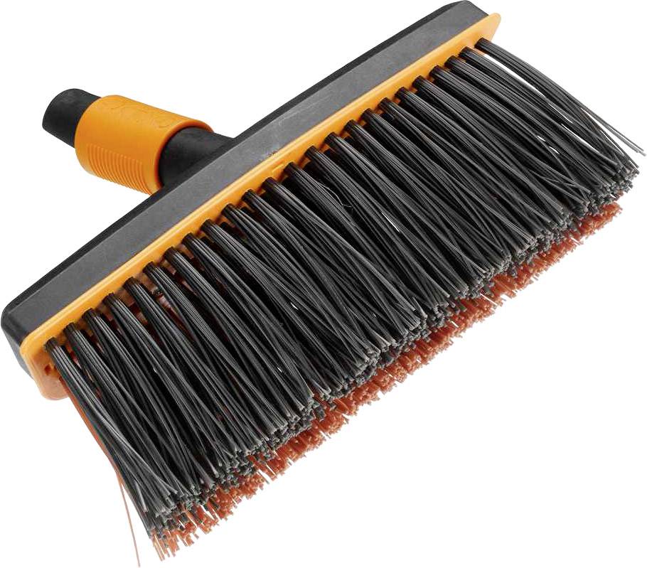 Ein Reinigungsgerät mit schwarzen Borsten und orangefarbenem Griff, das für die Reinigung von Oberflächen verwendet wird.