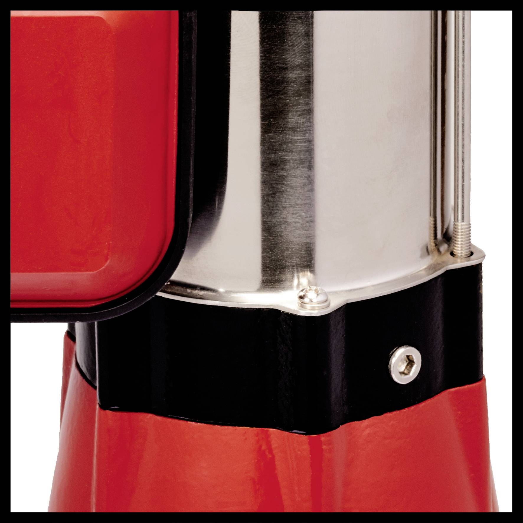 Ein Ausschnitt einer rot-schwarzen Metallstruktur mit silbernen Elementen, möglicherweise Teil eines Geräts oder einer Maschine.