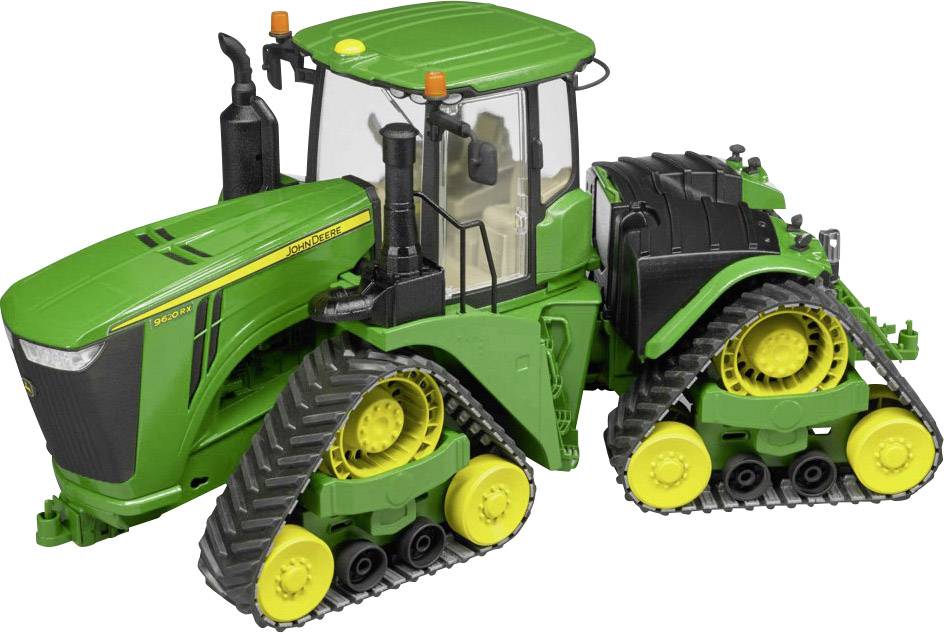 Ein grüner Traktor mit Kettenantrieb, moderne Kabine und gelbe Felgen. Modell eines leistungsstarken landwirtschaftlichen Fahrzeugs.