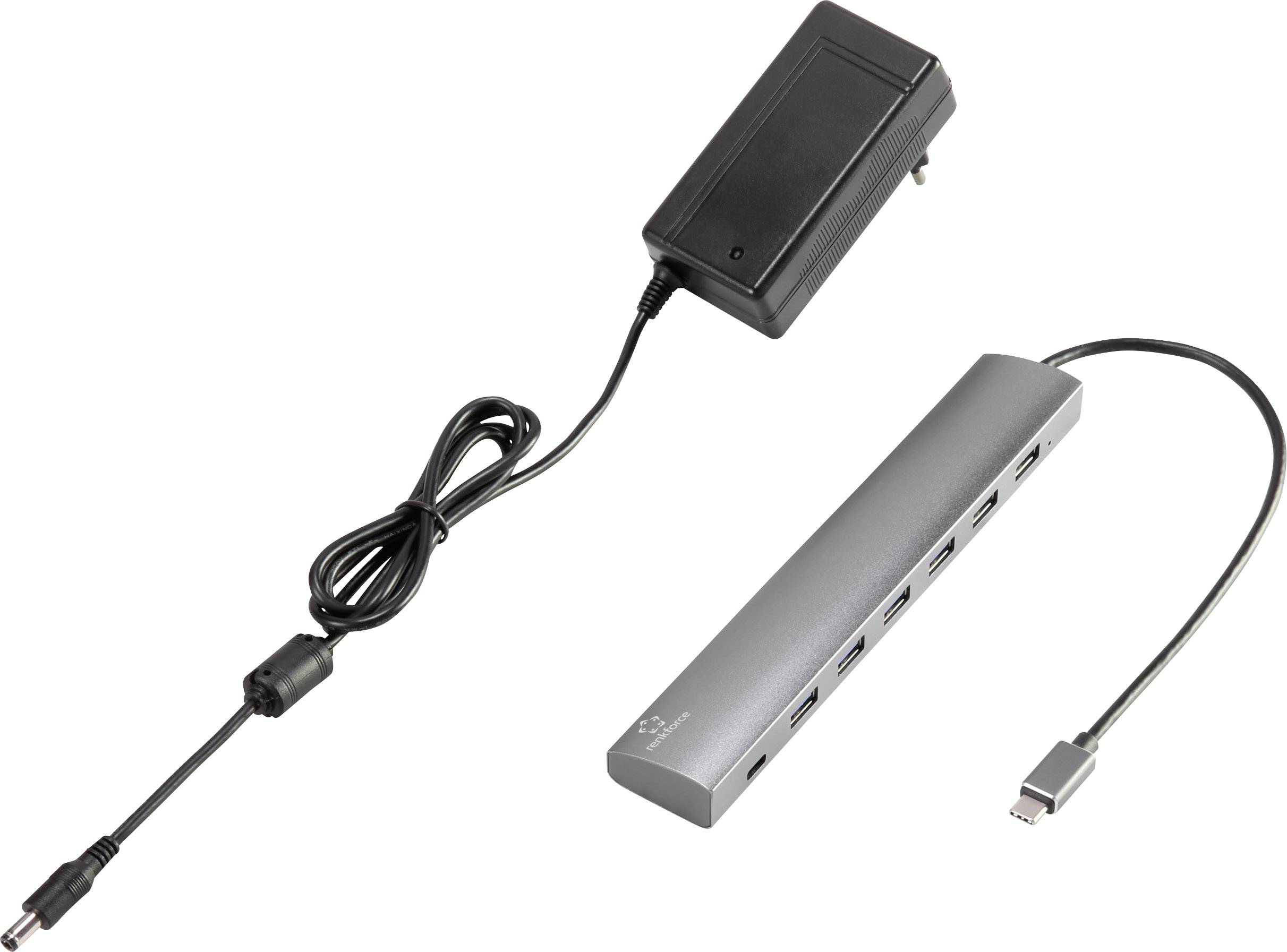 USB-C-Hub mit mehreren Anschlüssen und passendem Netzteil, Verbindungskabel zeigt auf den Hub, geeignet für diverse Geräteanschlüsse.