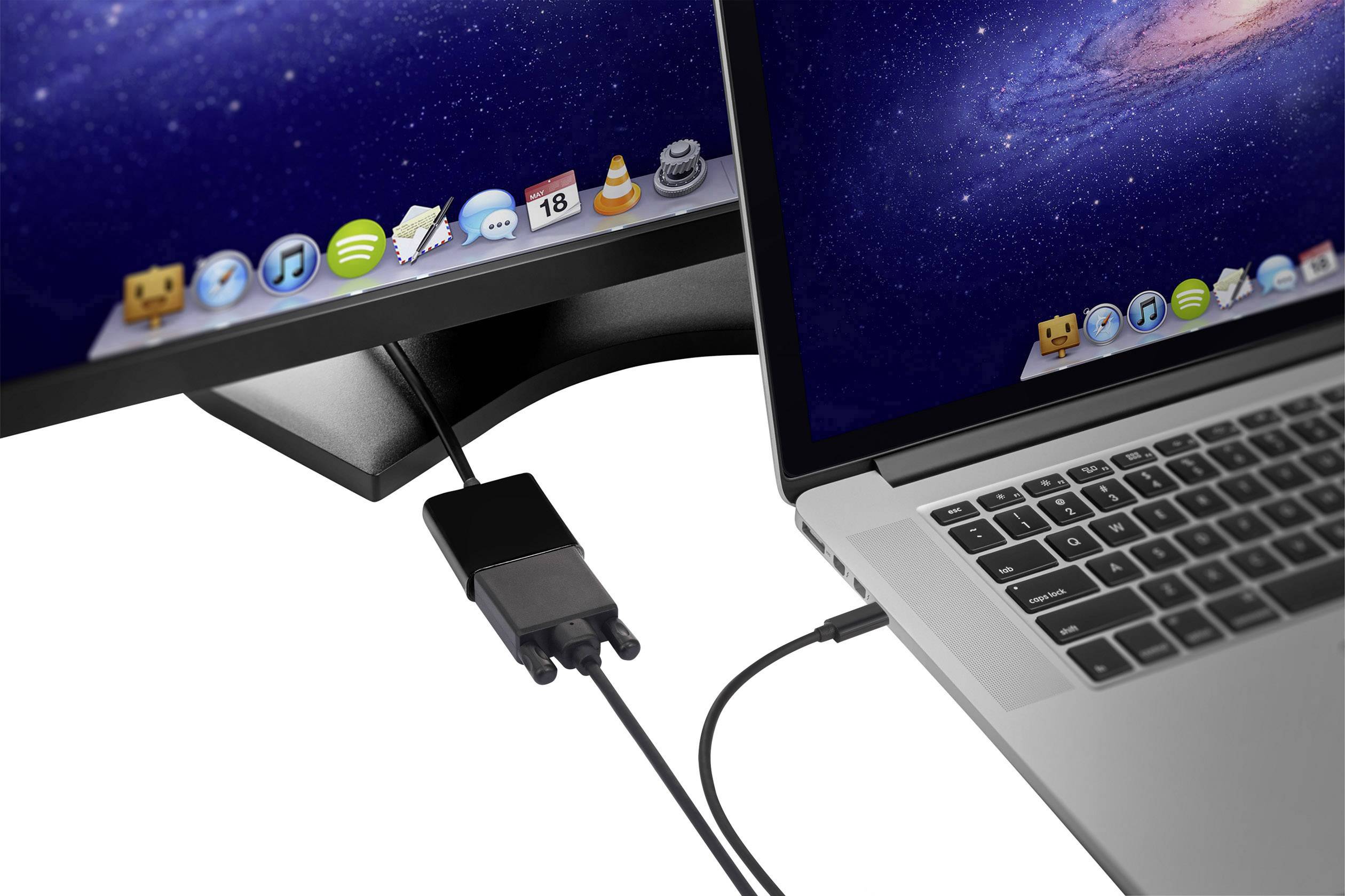 Ein Laptop ist mit einem Monitor verbunden, beide zeigen einen Desktop mit Apps. Es wird ein Adapter für die Verbindung genutzt.