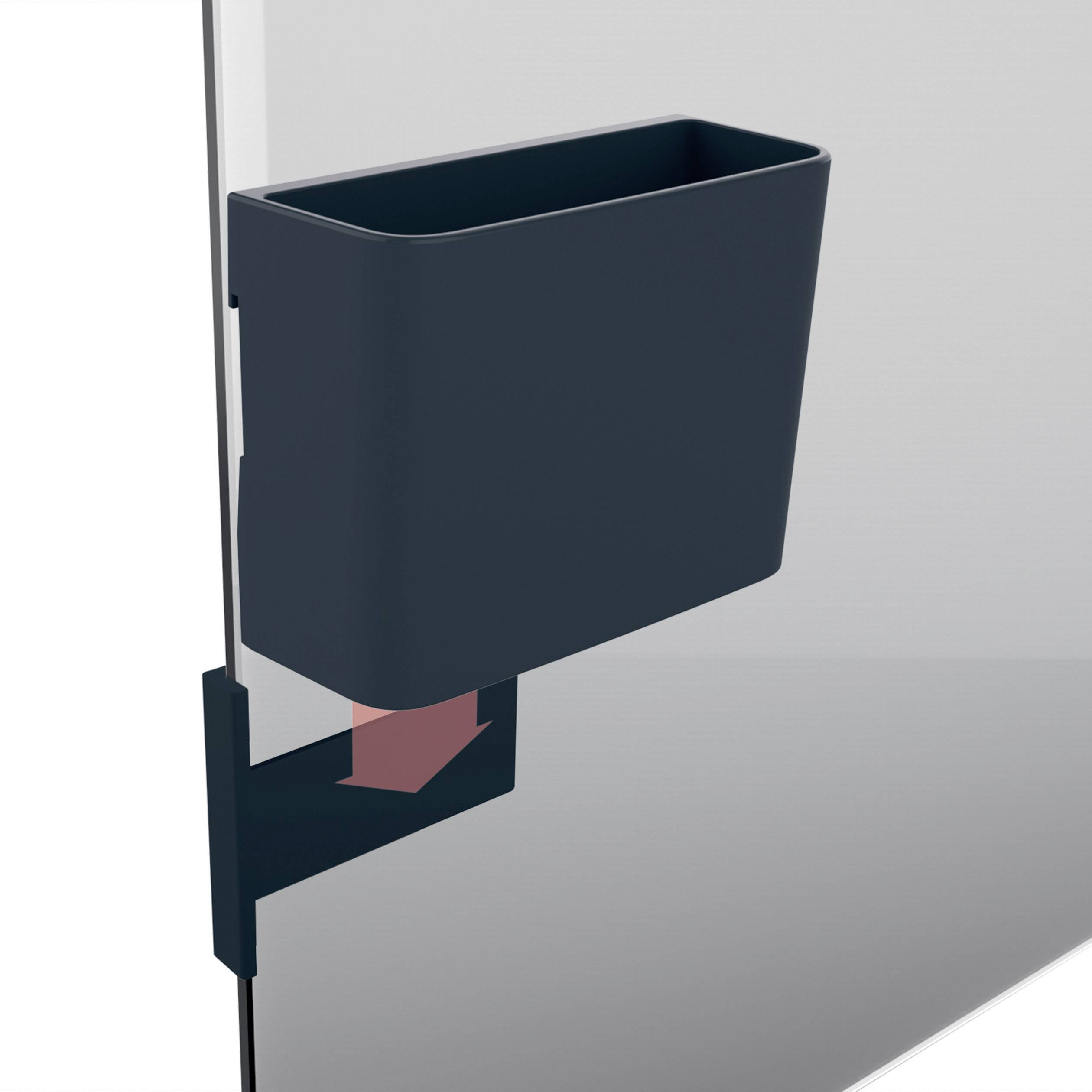 Ein schwarzer Behälter ist seitlich an einer transparenten Wand montiert. Der Behälter hat eine rechteckige Form und ist oben offen.