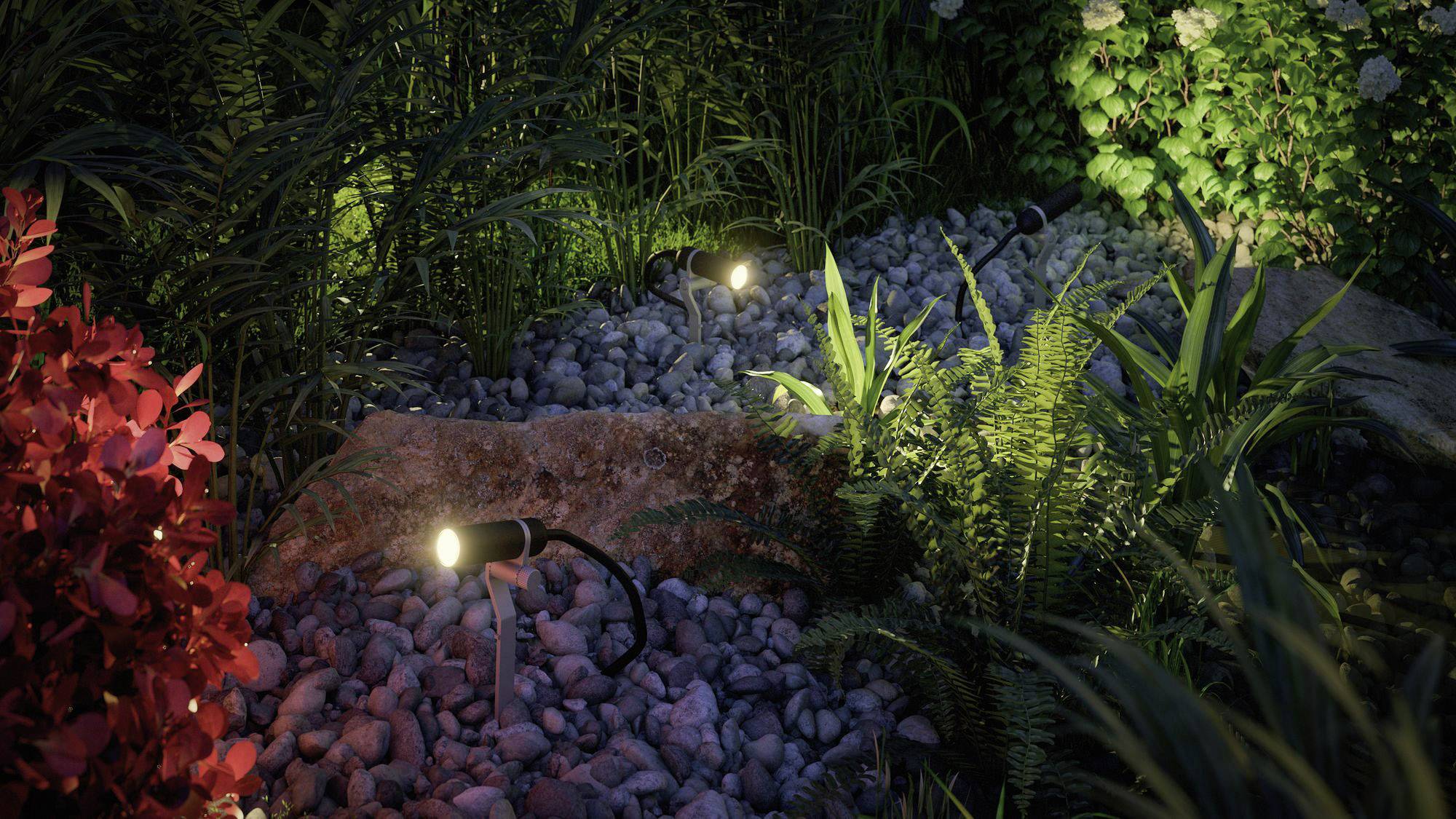 Garten mit Pflanzen und Sträuchern, beleuchtet von kleinen, warmen Lichtern zwischen Steinen. Stimmungsvoll und ruhig.