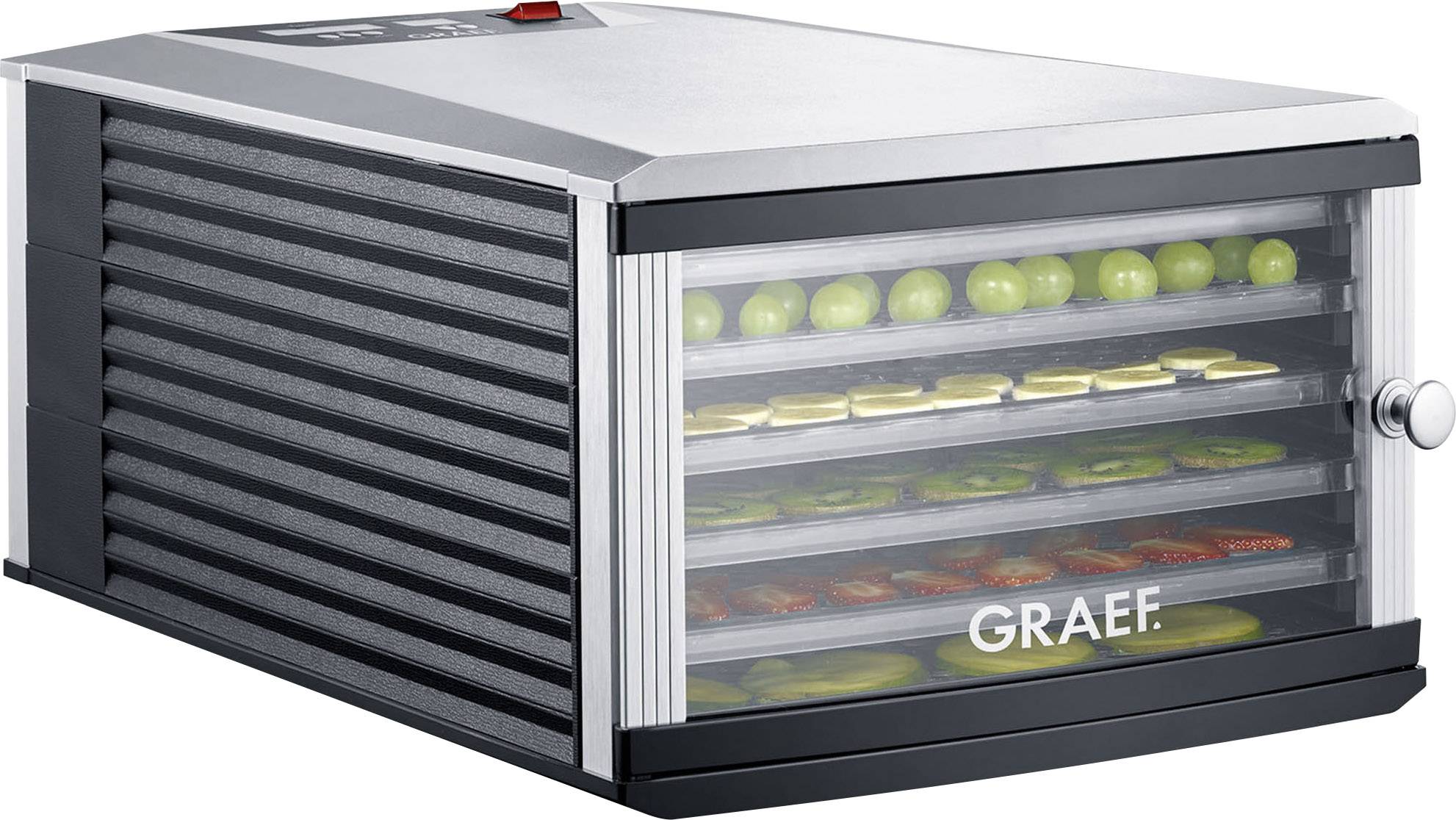 Obst- und Gemüsetrockner mit transparentem Deckel, zeigt mehrere Ebenen mit geschnittenen Äpfeln, Trauben und Tomaten.