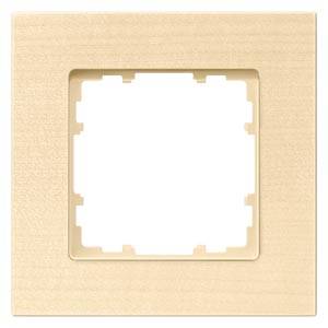 Beige Lichtschalterrahmen mit quadratischer Öffnung in der Mitte. Glatte Textur. Design für Innenräume zur Überdeckung von Schaltern.