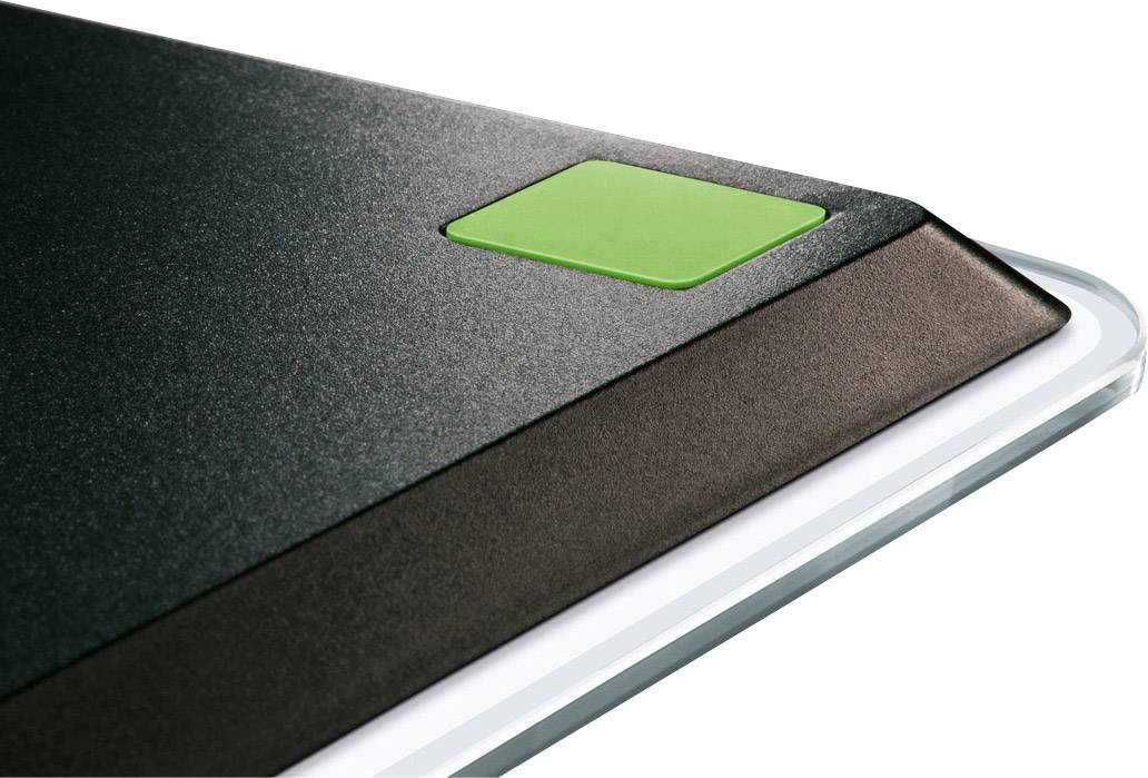 Ein schwarzes, keilförmiges Gerät mit einer grünen Taste auf der linken Ecke. Es scheint Teil eines größeren technischen Geräts zu sein.