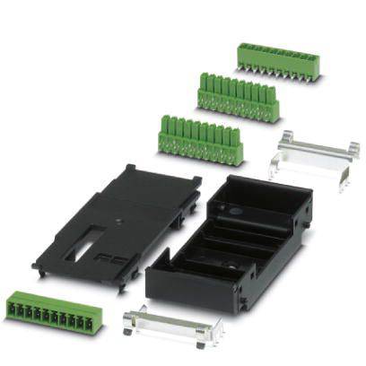 Elektronisches Bauteil mit schwarzen und grünen Steckverbindern und Abdeckungen, verteilt auf hellem Hintergrund.
