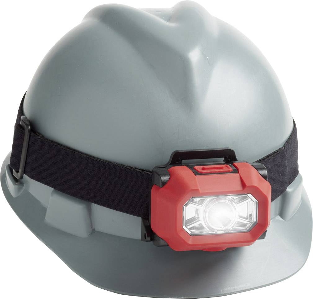 Ein grauer Bauhelm mit einer roten Stirnlampe, die an einem schwarzen Band befestigt ist. Die Lampe leuchtet hell nach vorne.