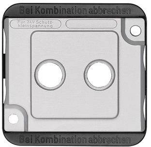 Eine quadratische Metallplatte mit zwei runden Löchern in der Mitte. Oben steht 'Bei Kombination abbrechen'.